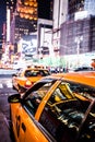 Yellow cab speeds through Times Square in New York. Royalty Free Stock Photo