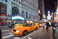 Yellow Cab in Times Square at night, New York City Royalty Free Stock Photo