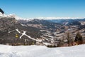 Yellow cable car ski lift going up on the mountain top Royalty Free Stock Photo