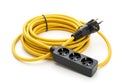 A yellow cable with three plugs on it AI generated Royalty Free Stock Photo