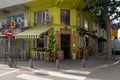 Yellow cafe restaurant on the corner of the street with chairs outside near the Lewinsky Market Royalty Free Stock Photo