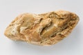 Yellow calcite mineral stone on white background, geology natural rock