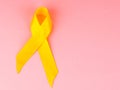Yellow cancer awareness ribbon as symbol of childhood cancer awareness, Support the Troops Ribbon Royalty Free Stock Photo