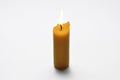 Yellow candle isolated on a white background