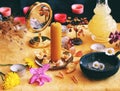 Yellow candle on Litha midsummer Sabbat Solstice celebration witch altar filled with flowers, rose petals, dandelions, crystals