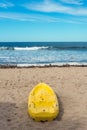 Yellow Canoe in Beach, Sand and blue sky.