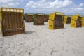 Yellow canopied beach chairs at Baltic Sea