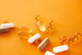 Yellow capsules of nutraceuticals in spoon. Pills and meds. Royalty Free Stock Photo