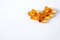 Yellow capsules of vitamins in the shape of a heart Royalty Free Stock Photo