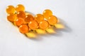 Yellow capsules of vitamins in the shape of a heart Royalty Free Stock Photo