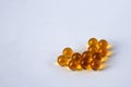 Yellow capsules of vitamins in the shape of a heart Royalty Free Stock Photo