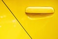 Yellow Car door handle Using wallpaper or background Royalty Free Stock Photo