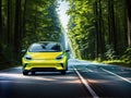 A yellow car driving down a winding road through a forest.