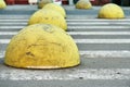 Yellow car parking barriers on zebra crossing Royalty Free Stock Photo