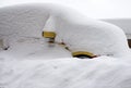 Yellow car under snow after blizzard Royalty Free Stock Photo