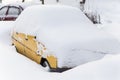 Yellow car under snow Royalty Free Stock Photo