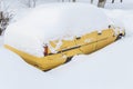 Yellow car under snow Royalty Free Stock Photo