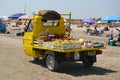 yellow cargo scooter, fresh fruit delivery to the beach,