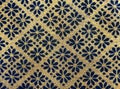 Yellow carpet with a pattern of blue flowers. Royalty Free Stock Photo