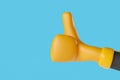 Yellow cartoon glove with thumbs up hand gesture against blue background. Colorful, funny and friendy gestures. Royalty Free Stock Photo