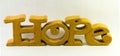 Yellow Carved Wooden Hope Sign