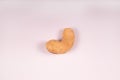 yellow cashew nut on white surface