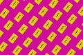 yellow cassettes tapes on a pink background pattern