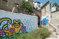 Yellow cat Graffiti and Street art in a street of Lisbon, Portugal Royalty Free Stock Photo
