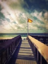 Yellow caution beach flag at Navarre Beach, Florida. Royalty Free Stock Photo