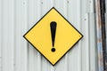 A yellow caution exclamation mark metal sign Royalty Free Stock Photo