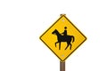 Yellow Caution Horse Rider Riding Sign Isolated Against a White Background Royalty Free Stock Photo