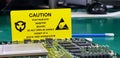 The yellow CAUTION label for Electrostatic Sensitive Devices ESD on static free workstation