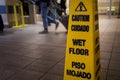 Yellow caution slippery wet floor sign . Royalty Free Stock Photo