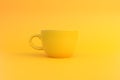 Yellow ceramic coffee cup on yellow background Royalty Free Stock Photo