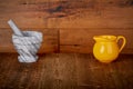 Yellow Ceramic Jug and Marble Stone Mortar and Pestle on Reclaimed Wood Background Shooting Surface Backdrop for Mockup Royalty Free Stock Photo