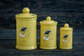 Yellow Ceramic Spice Containers with Lid on Blue