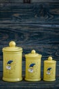 Yellow Ceramic Spice Containers with Lid on Blue