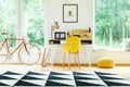 Yellow chair in bright workspace