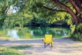 Yellow chair by the river