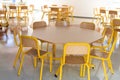 Yellow chairs table children school cafeteria