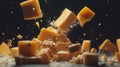 Yellow Cheese Cubes Falling Against Dark Background Royalty Free Stock Photo