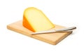 Yellow cheese and kitchen knife on a cutting board Royalty Free Stock Photo