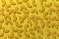 Yellow cheese pasta. On a yellow background. Hard shadows. Top view.