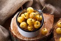 Yellow cherry in a rustic style on a wooden background. Berries of ripe fresh cherries in a cup. Royalty Free Stock Photo