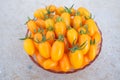 Yellow fresh cherry tomato in small bowl