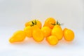 Yellow cherry tomato fruits, plant Solanum lycopersicum, wooden