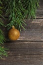 Yellow Christmas ball on wooden background