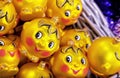 Yellow christmas balls with cute baby faces. Christmas tree decoration in the form of a kolobok from a Russian fairy tale Royalty Free Stock Photo