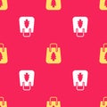 Yellow Christmas paper shopping bag icon isolated seamless pattern on red background. Package sign. Merry Christmas and Royalty Free Stock Photo
