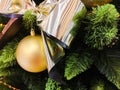 Yellow christmas toys on the tree. Golden christmas background of defocused lights with decorated tree Royalty Free Stock Photo